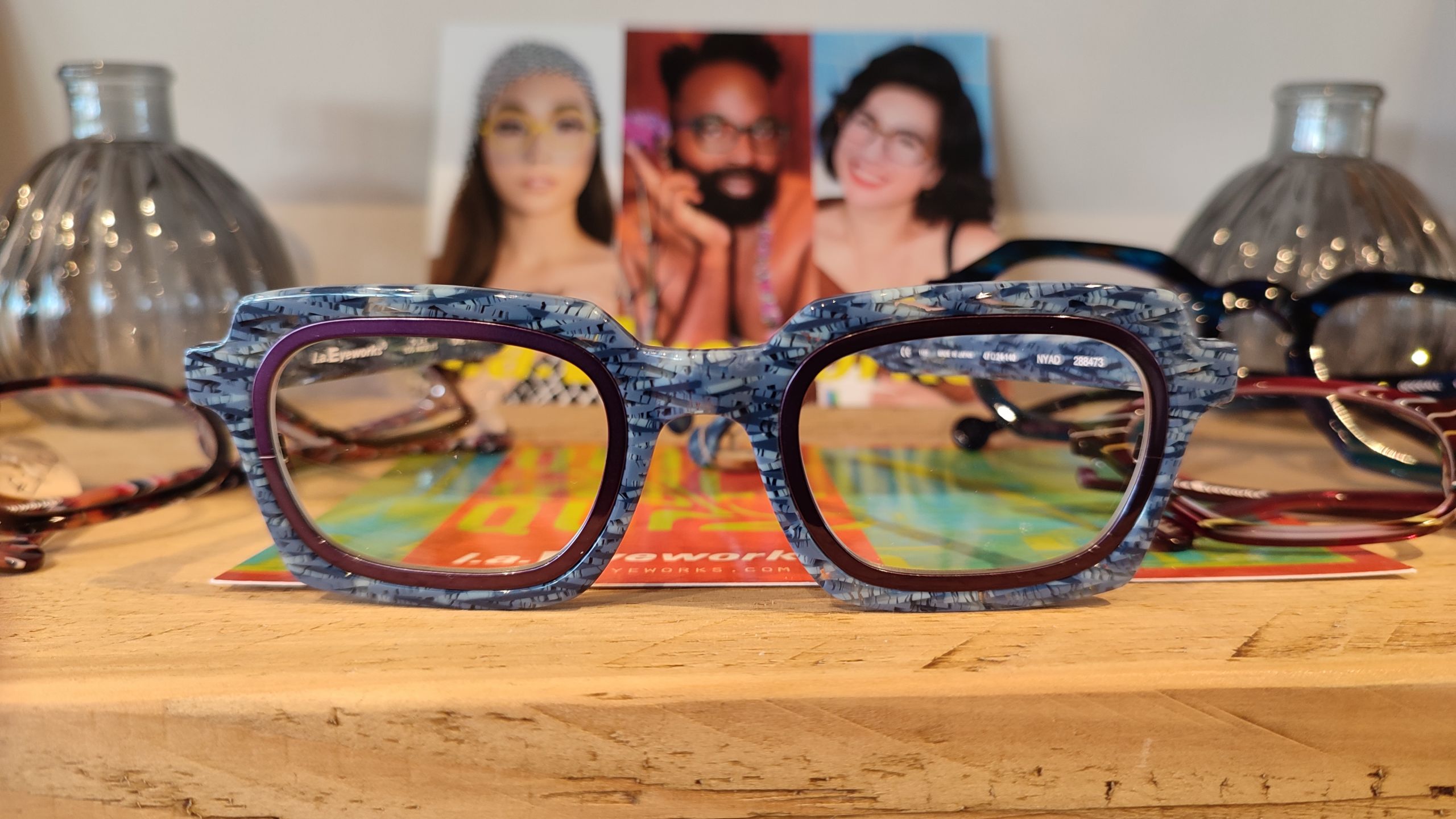 The 'Nyad' frame by laEyework in Water weave with a grape metal insert showcases refined luxury and sleek, stylish design.