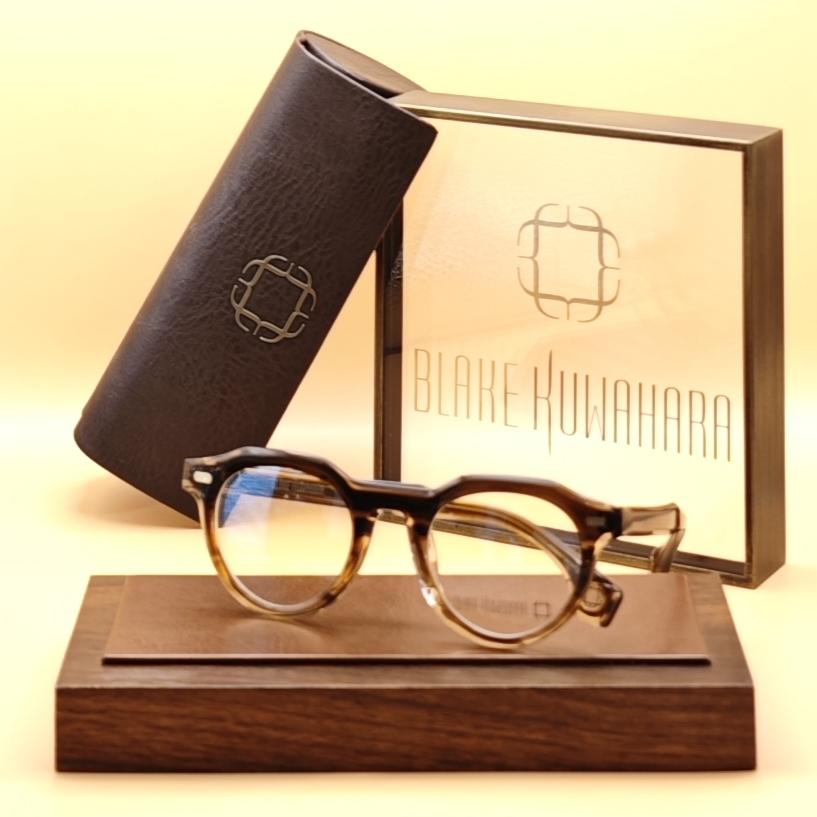 Blake Kuwahara's Perkins rounded square optical frames in a brown tortoiseshell upper rim and clear crystal lower rim.