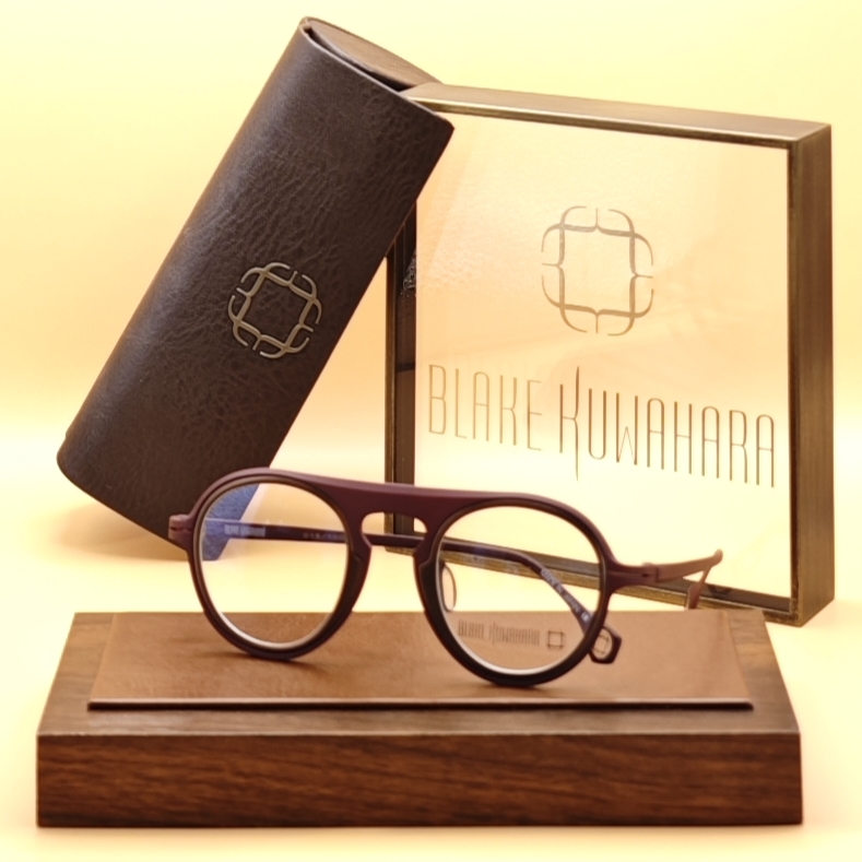 Blake Kuwahara's Straub perfectly round optical frames with a thick, matte burgundy limited edition metal frame