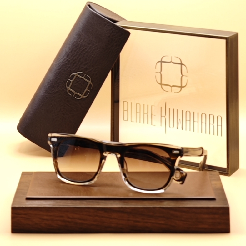 Blake Kuwahara's Gibbings square sunglasses in a brown and black tortoiseshell gradient over clear, with dark gradient lenses.