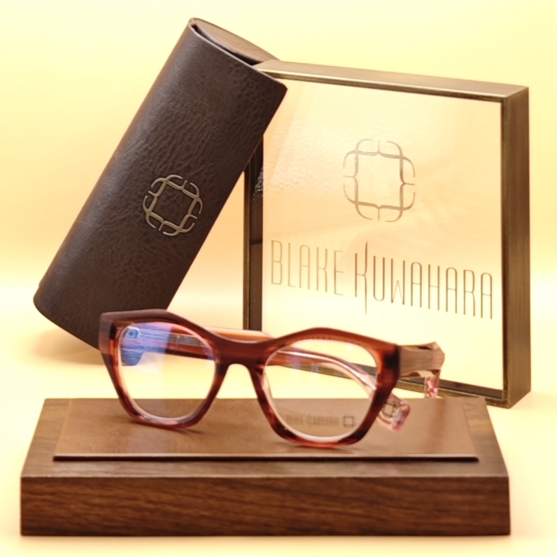 Blake Kuwahara's BK 1035 angular cat-eye optical frames in a rich red-brown and amber tortoiseshell acetate.