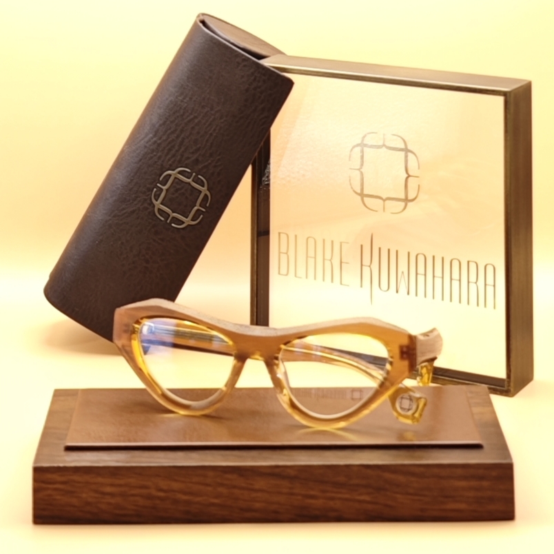 Blake Kuwahara's BK 1031 dramatic cat-eye optical frame in a translucent honey-amber colored acetate.