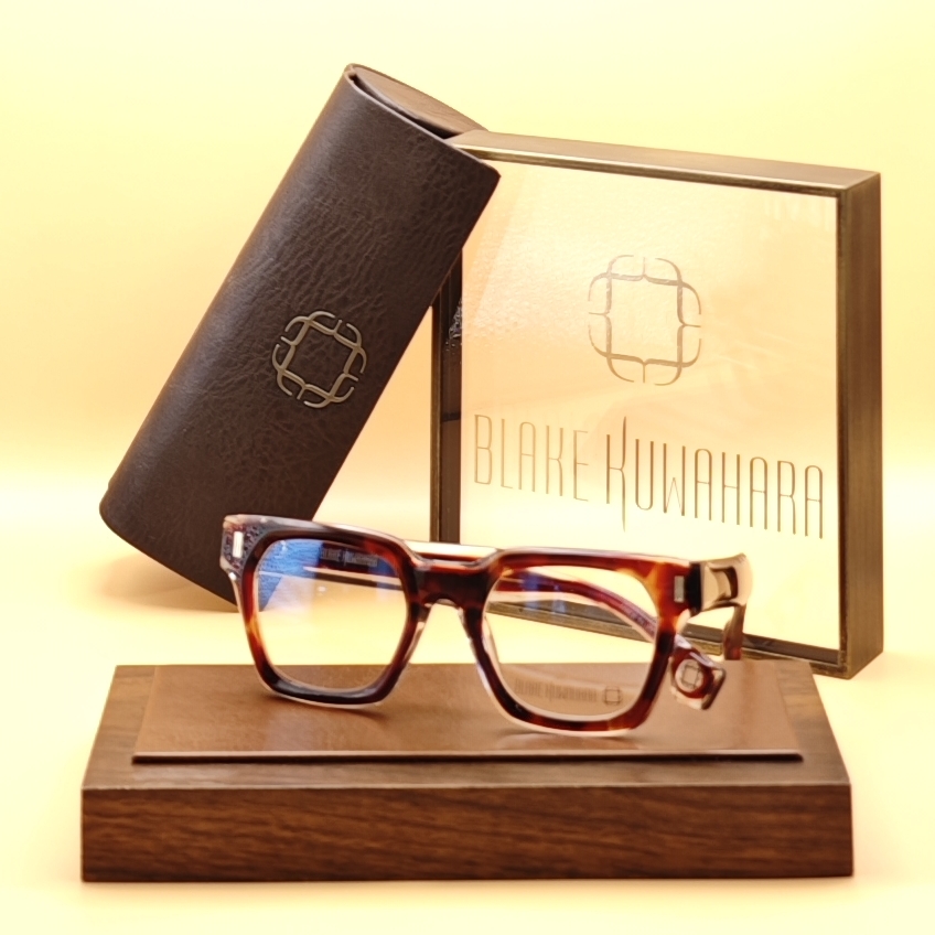 Blake Kuwahara's Hensman chunky square optical frames in a classic glossy red and amber tortoiseshell acetate.