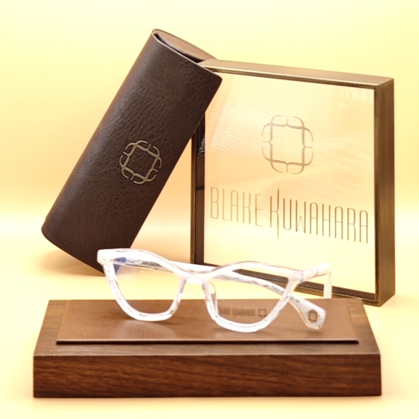 Blake Kuwahara's May upswept, subtle cat-eye glasses in bright, translucent white or pale clear acetate.