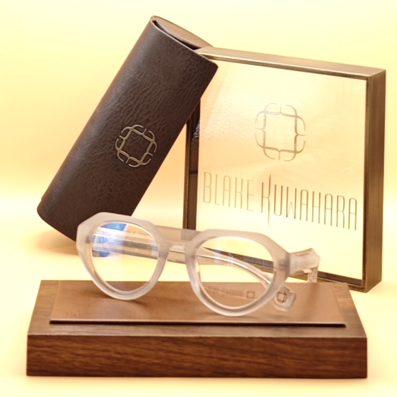 Blake Kuwahara's BK 1032 chunky, sculpted cat-eye glasses in frosted, translucent white/clear acetate.