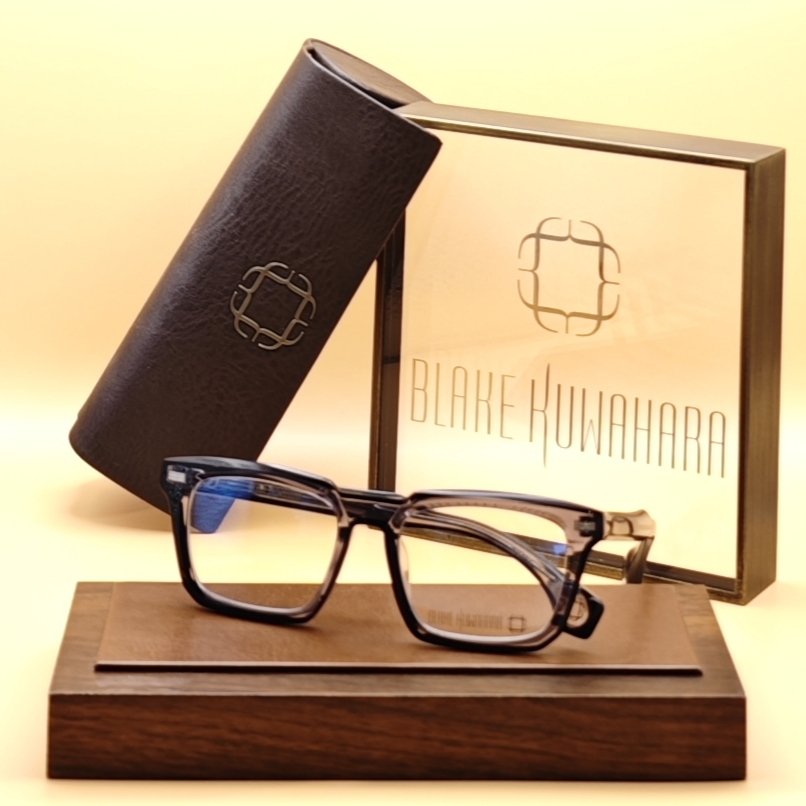 Blake Kuwahara's Proctor rectangular glasses with a smooth gradient from dark grey/black to clear acetate.