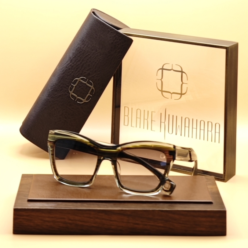 Blake Kuwahara' Aalto cat-eye glasses in solid Pine and gold acetate with a thick browline.